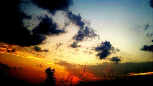 Low angle view of cloudy sky at sunset