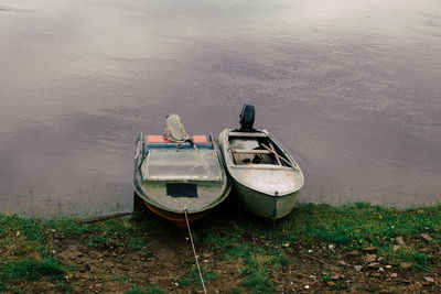 High angle view of abandoned boat moored at lakeshore