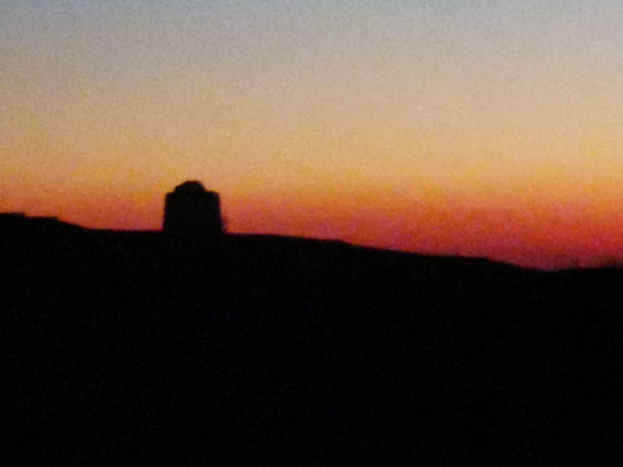 SCENIC VIEW OF SILHOUETTE LANDSCAPE AGAINST ORANGE SKY