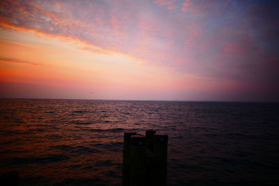 Close-up of sea against sky during sunset