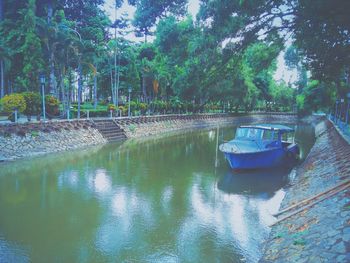 Boats moored on lake