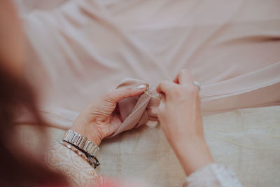 High angle view of woman holding hands