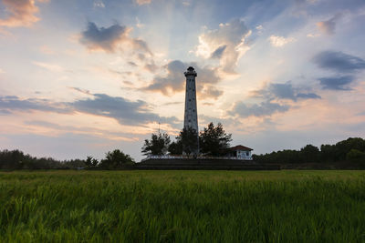 Scenic view of field against sky during sunset