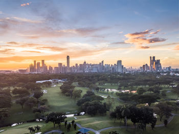 Aerial view of city buildings during sunset
