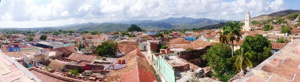 High angle view of cityscape against cloudy sky