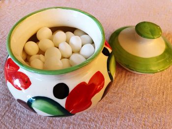 High angle view of candies in bowl on table