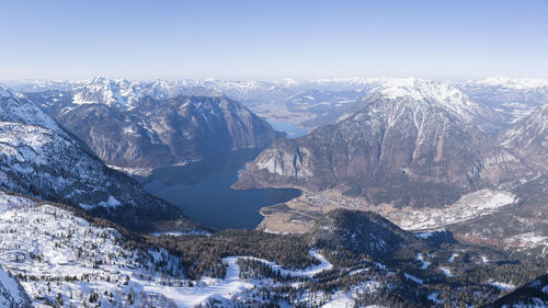 Amazing view on snowy winter alpine landscape with valley, mountains and lake, austria, europe