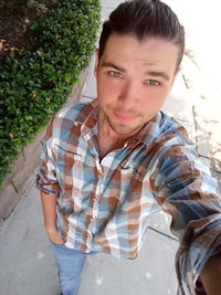 Portrait of young man standing outdoors