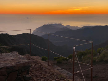 Scenic view of mountains against sky during sunset