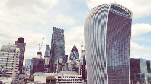 Low angle view of skyscrapers against sky