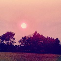 Scenic view of landscape against sky at sunset