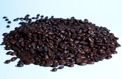 Close-up of coffee beans against white background