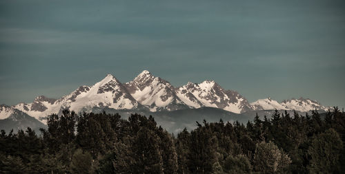 Scenic view of snowcapped mountains against sky