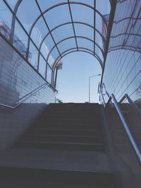 Low angle view of staircase in building against sky