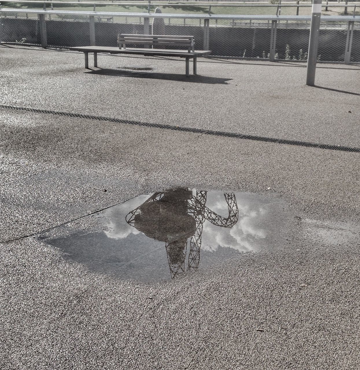 puddle, water, street, road, high angle view, reflection, asphalt, wet, outdoors, day, standing water, footpath, rainy, tranquil scene