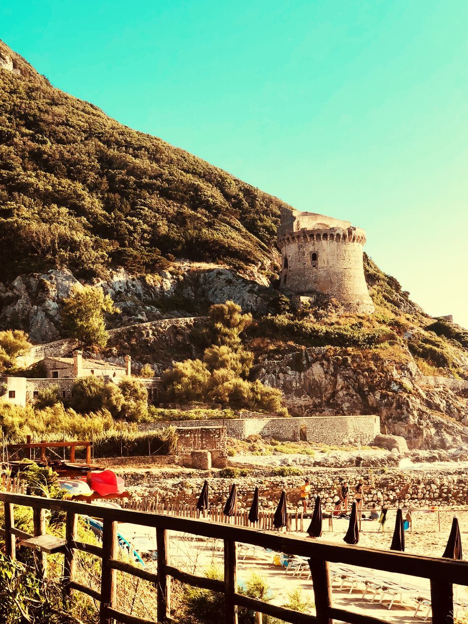 architecture, built structure, sky, building exterior, mountain, nature, day, clear sky, history, the past, railing, real people, travel destinations, crowd, land, environment, travel, tourism, ancient, city, ancient civilization