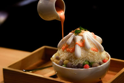 Close-up of ice cream in bowl on table