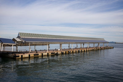 Pier over sea against sky