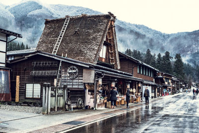 People walking on road in rain