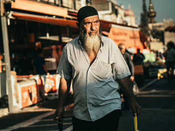 Portrait of man standing outdoors