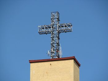 Low angle view of traditional building against clear blue sky