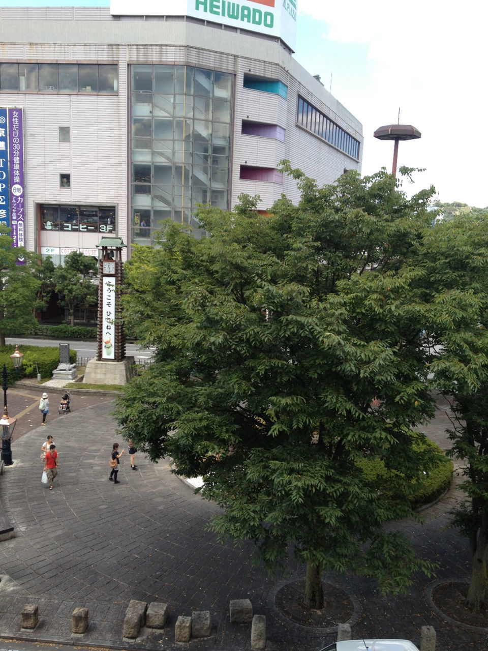 building exterior, architecture, built structure, tree, city, building, day, men, sky, street, residential building, lifestyles, incidental people, outdoors, city life, plant, residential structure, growth, person