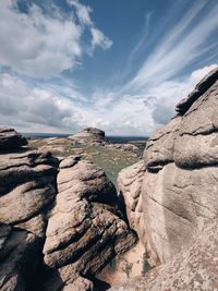 Rock formations on landscape against sky