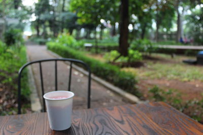 View of empty glasses on table in park