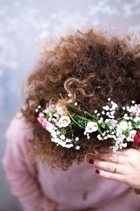 Cropped hand holding flower