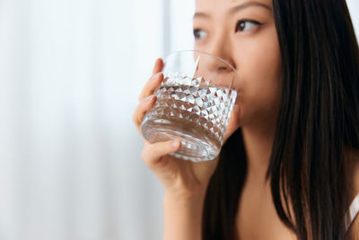 Young woman drinking water