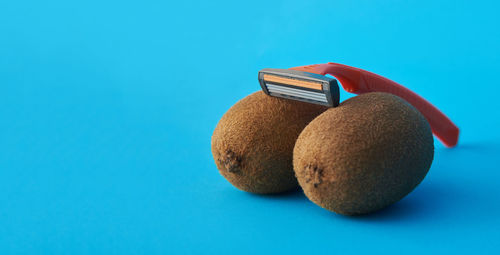 Close-up of fruits on blue background