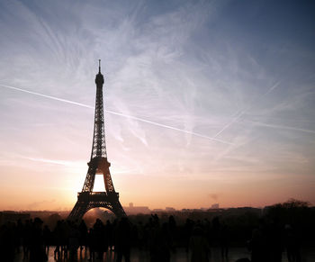 Silhouette of tower against sky at sunset
