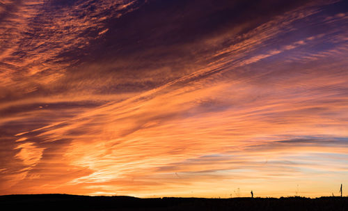 Low angle view of dramatic sky during sunset