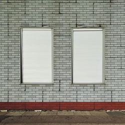 White window on brick wall