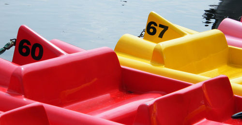 Close-up of red and yellow paddle boats