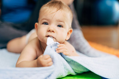 Portrait of cute baby boy looking away