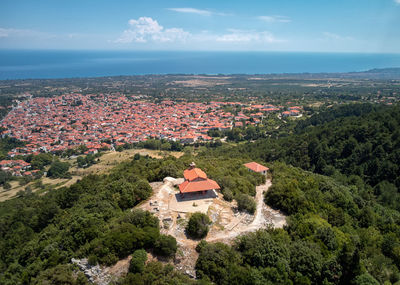 High angle view of houses and trees against sky