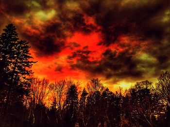 Low angle view of dramatic sky at sunset