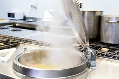 Steam emitting from container in kitchen