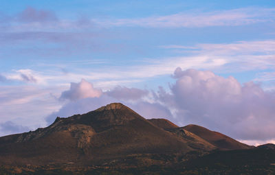 Low angle view of mountain against sky during sunset