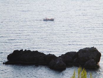 Scenic view of rock sailing in sea