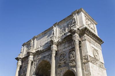 Low angle view of historical building against blue sky