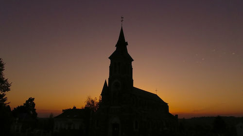 Silhouette of church at sunset