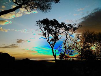 Scenic view of landscape against sky at sunset