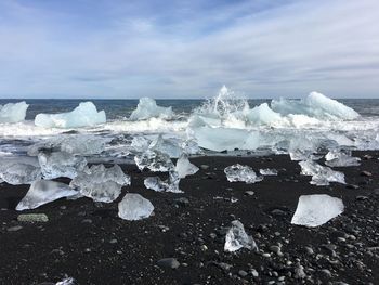 Aerial view of frozen sea against sky