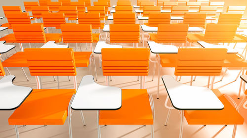 High angle view of empty chairs at table