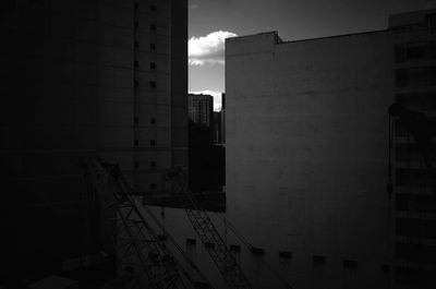 Construction site in city against sky