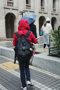 Full length of woman standing on street