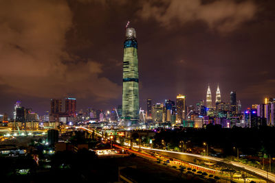 Illuminated modern buildings in city at night