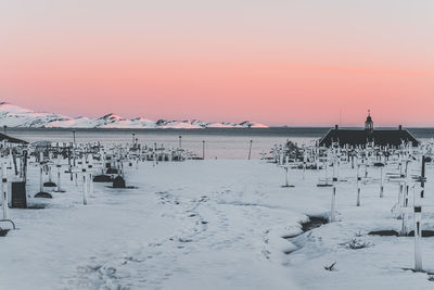 Scenic view of snow covered landscape during sunset